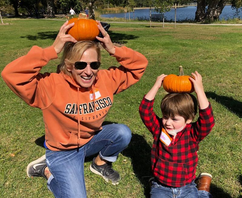 Picture of Janet Anderson balancing pumpkin on head